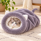Cat relaxing in the Vetsuno PurrNest gray fleece sleeping cocoon on a cozy rug